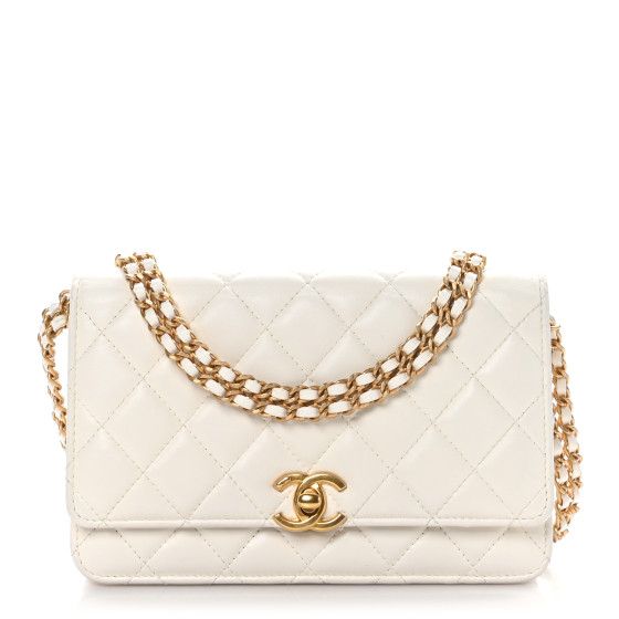 This is an authentic CHANEL Lambskin Quilted Logo WOC Wallet On Chain in White. This stylish wallet on a chainis made of luxuriously textured lambskin diamond-quilted white leather. The bag features a waist-length gold chain link shoulder strap with Chanel logo name latter motifs and white enamel accents. The bag features an exterior patch pocket and a gold Chanel CC logo turn lock on the facing flap. This opens to a black fabric interior with card slots, zipper compartment, and patch pockets. Classic Quilted Wallet On Chain For Evening, Classic Quilted Evening Wallet On Chain, Luxury Quilted Rectangular Wallet On Chain, White Rectangular Wallet On Chain For Evening, White Chic Wallet On Chain For Formal Occasions, Chic White Wallet On Chain For Formal Occasions, Elegant White Rectangular Wallet On Chain, Classic White Leather Wallet On Chain, White Leather Classic Wallet On Chain