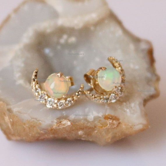 Delicate 14K Yellow Gold Studs, Mini Gemstone dainty Studs, Dainty Single Dot Studs, Natural Fire Opal Studs, Product info:14k solid goldwhite diamonds, I color, SI claritywhite diamonds - 1 mm, I, SI clarityOpal: Ethiopian Natural, 4mmStud Size: 10 mmItem will be resized and shipped within 10 days.ITEM Will BE SHIPPED : India Speed PostTo get the item in 4-5 days, we can also ship it thru DHL express, please contact us before.Please select your size at the drop down menu.Thanks!♥Shipping Policy Celestial 14k Gold Gemstone Jewelry, Delicate Moon Shaped Jewelry For Anniversary, Delicate Moon-shaped Jewelry For Anniversary, Oval 14k Gold-filled Jewelry For Anniversary, Dainty Crescent White Gold Jewelry, Dainty Crescent Jewelry For Anniversary, 14k Gold Celestial Yellow Gold Earrings, 14k Yellow Gold Celestial Earrings, Sterling Silver Crescent Jewelry For Weddings