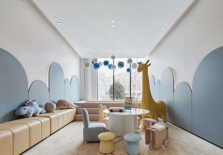 the children's room is decorated in pastel colors and features an animal theme