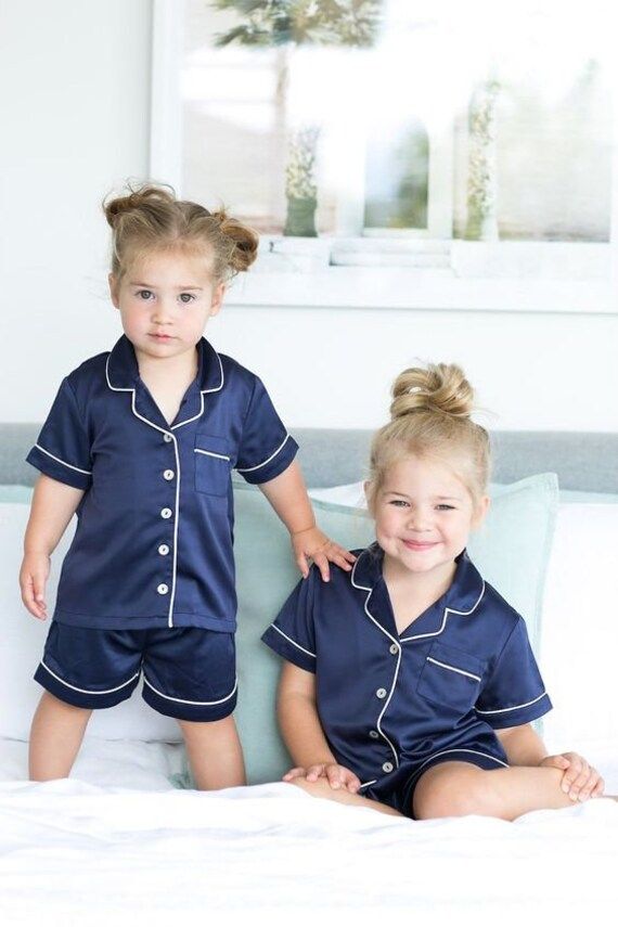 🔅 50 %  SALE   is   LIVE 🔅 Description Baby kids pajama sets is made of satin fabric , silky-smooth, very softly and comfy. Lightweight and skin-friendly material care for children both girls and boys. FEATURE - Unisex satin Pjs set with long sleeved button-down top and elastic waist pants, making your kids feel relax. Classic notch collar,chest pocket lend sophisticated detail. ⭐️⭐️ LISTING FEATURES ⭐️⭐️ ⭐️Shirt + Pajamas ⭐️ Long Sleeve / Short Sleeves (Please mention it in personalization) ⭐ Birthday Pajamas, Pijama Satin, Sleeping Wear, Pajamas For Kids, Kids Spa Party, Daughter Graduation, Satin Pjs, Girl Pajamas, Childrens Pyjamas