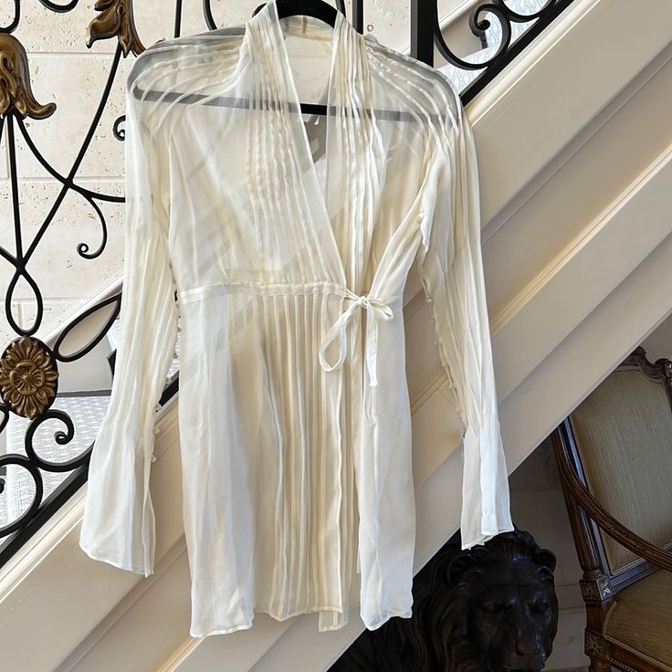 Sheer Silk Blouse. Top Is Brand New From Neiman Marcus Has Buttons Down The Sleeves With A Fluted Cuff Spring Silk Beach Blouse, Silk Beach Blouse For Spring, Spring Silk Tops For Brunch, Silk Tops For Spring Brunch, Chic Silk Beach Blouse, White Silk Blouse For Summer, Elegant Sheer Tops For Brunch, Elegant Fitted Blouse For Beach, Sheer Blouse For Brunch