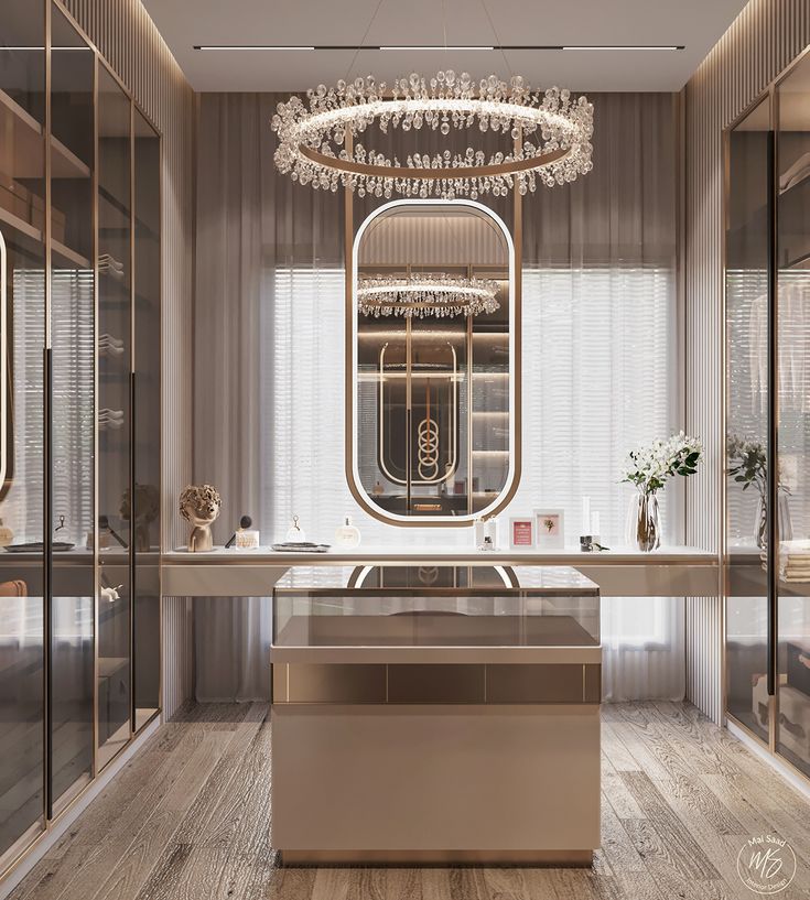 an elegant bathroom with mirrored walls and chandelier