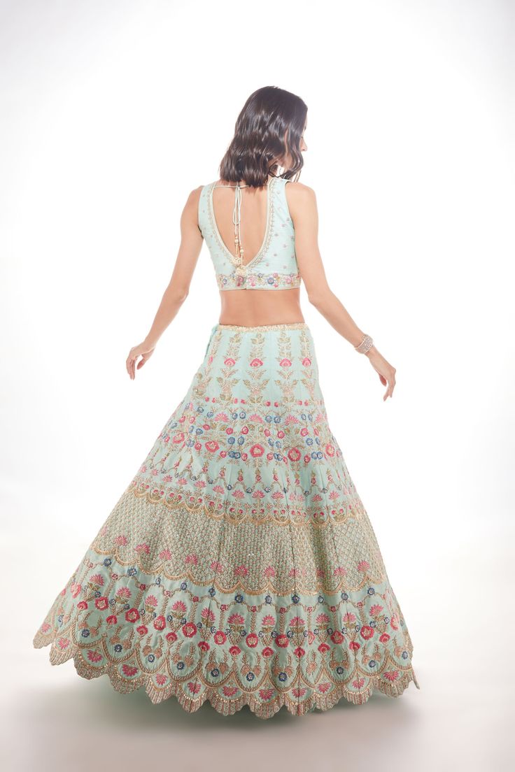 A silk lehenga with zardozi, sequins, and resham embroidery paired with a matching blouse and net dupatta with a floral border From Chamee and Palak The Wedding Edit collectionDELIVERY TIMEPlease allow 8-12 weeks for your outfit to arrive.FABRIC DETAILSSilk And NetProfessional cleaning only.