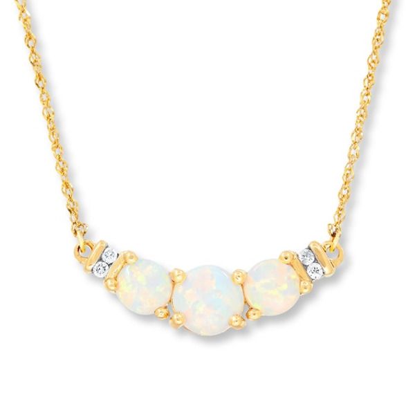 The glistening shimmer of three lab-created opals pairs with the sparkle of diamond accents in the center of this fascinating necklace for her. Fashioned in 10K yellow gold, the pendant suspends between a 17-inch Singapore chain that secures with a spring ring clasp. Opal Necklaces For Anniversary, Gold Stock, Jewelry Advice, Jared The Galleria Of Jewelry, Necklace For Her, Necklace Diamond, Diamond Guide, White Necklace, Opal Necklace