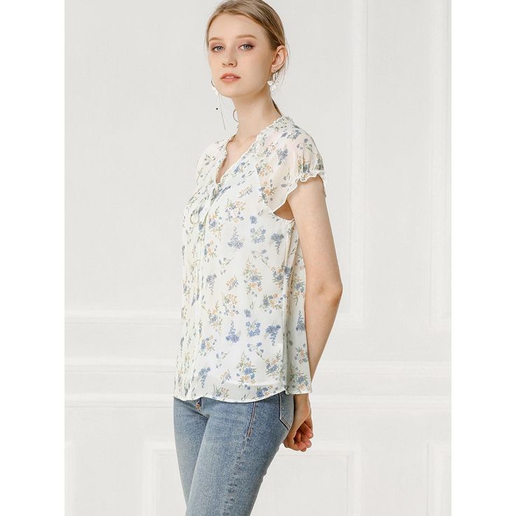 Lightweight and breezy, the shirt is perfect for sunshine styling. A floral print updates this top, perfect for adding a summer pattern to warm-weather looks. Made of a lightweight fabric, the printed style has a self-tie decor at the neckline and a ruffled trim. It has a loose fit that falls to the hip, so you can easily tuck it into skirts or jeans. Flowy Floral Print Top For Day Out, Feminine Chiffon Blouse For Spring, Casual Chiffon V-neck Top, Spring Chiffon V-neck Blouse, Breezy V-neck Summer Top, Chic Chiffon Top With Floral Print, Spring Flowy Short Sleeve Blouse, Flowy Floral Print Top For Spring, Summer V-neck Blouse With Ditsy Floral Print