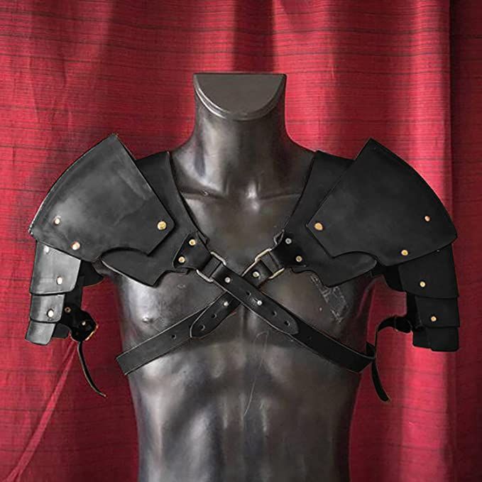 a male mannequin with leather armor on it's chest and shoulder straps