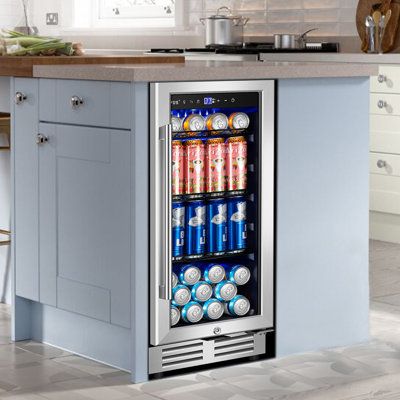 a beverage cooler sitting in the middle of a kitchen