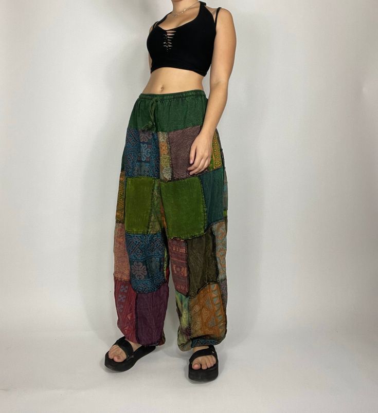 Bohemian mixed patchwork hippie pants in black/ mixed color patches. Each pair is slightly unique and will have some different patches and colorings! Waist stretches from 24-35' inches comfortably. Model is 5'2 for reference. Measurements: inseam: 31’ Waist: 24’-35’ Baggy Patchwork Pants, Corduroy Pants Patchwork, Hippie Indie Outfits, Patchwork Hippie Pants, Hippie Pants Outfit, How To Make Patches, Festival Mode, Patch Pants, Patchwork Pants