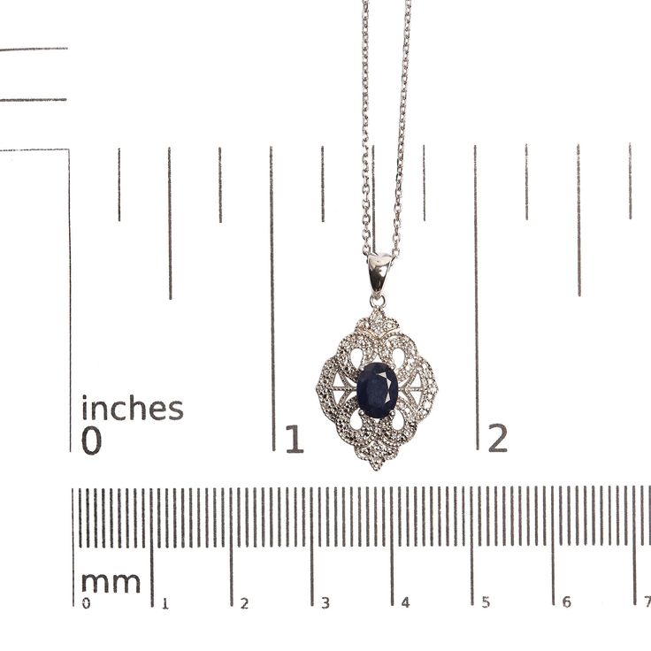 Indulge in the ethereal beauty of this Art Deco style shield-shaped pendant necklace. Crafted with .925 sterling silver, it radiates elegance and grace. Adorned with a captivating 7x5 MM oval blue sapphire and 34 dazzling diamond accents, this necklace is a true masterpiece. The natural diamonds, with a total weight of diamond accent, are expertly set in a shared prong setting, ensuring their brilliance shines through. The I-J color diamonds beautifully complement the striking blue sapphire, cre Accent Art, Elegant Art, Estilo Art Deco, Blue Gemstones, Sapphire Gemstone, Art Deco Style, Style Art, Silver Diamonds, Deco Style