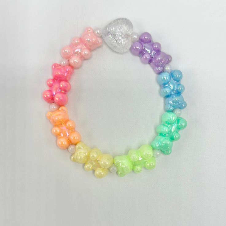 Beautiful rainbow AB gummy bear bracelet. Fits an approximately 7 inch wrist. I can make one smaller or larger upon request, just message me. These colors are kind of neon pastel-so gorgeous! Gummy Bear Bracelet, Cheap Novelty Rainbow Beaded Bracelets, Gummy Bear Bracelet Beads, Gummy Bear Accessories, Gummy Bear Necklace, Kawaii Bracelet, Bear Bracelet, Neon Pastel, I'm Broke