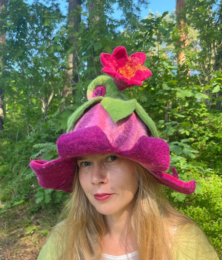 Beautiful pink and purple  bell flower hat with rolled stem Pixie hat, Winter hat, Fairy hat, Theater hat, felt wool hat Unique hat in which you will feel amazingly good. It is from natural material and created with love. Warmth, coziness, pleasure and festive feeling will embrace you. Good mood is guaranteed. A good gift for a good person. Hat has a wide usage: it can be a sauna hat, an everyday hat, or a hat for a special occasion. As a sauna hat it will protect your head and hair from the hea Purple Whimsical Winter Hat, Whimsical Purple Winter Hat, Handmade Purple Mini Hats With Curved Brim, Whimsical Brimmed Felt Hat, Whimsical Winter Brimmed Felt Hat, Handmade Whimsical Felt Hat With Short Brim, Adjustable Whimsical Felt Hat, Whimsical Fitted Brimmed Hat, Whimsical Handmade Felt Hat