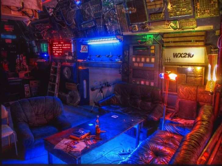 a living room filled with furniture and neon lights