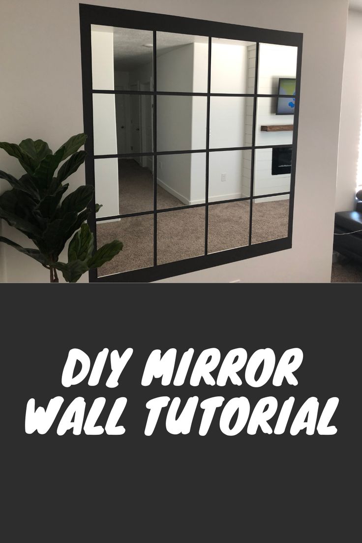 a mirror that is on the wall in front of a couch and window with words diy mirror wall tutorial