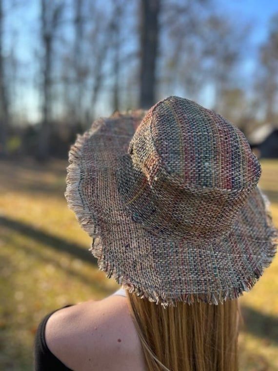 Hemp Summer Beach Sun Hat Just in from Nepal! Perfect for summer...at the beach, pool, festival or just hanging around. Color options: Tan with Stripes (Ansley), Red, and Rainbow. Each role of hemp fabric is handmade in Nepal so always slight variations. New Photos with exact colors for this winter/spring season! *Hemp sun hat made from 100% hemp with a soft organic cotton lining, wire brim makes it easy to reshape. Wide brim perfect to protect your head and face from too much sun. *This hat is One Size Flat Brim Sun Hat For Vacation, Adjustable Wide Brim Hat For Music Festivals, Brown Handwoven Summer Sun Hat, Summer Wide Brim Handwoven Bucket Hat, Summer Handwoven Wide Brim Bucket Hat, Adjustable Handwoven Bucket Sun Hat, Multicolor Summer Straw Hat For Festival, Summer Multicolor Straw Hat For Festival, Multicolor Summer Festival Straw Hat