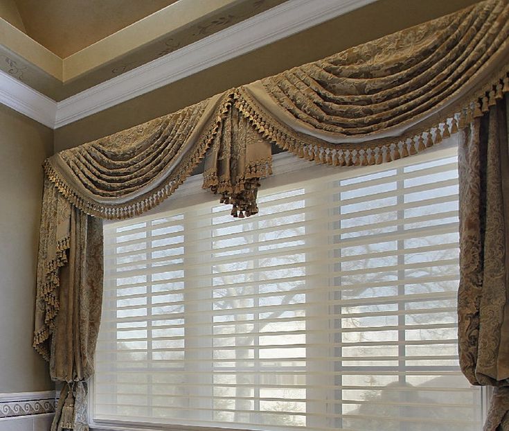 a large window with curtains hanging over it