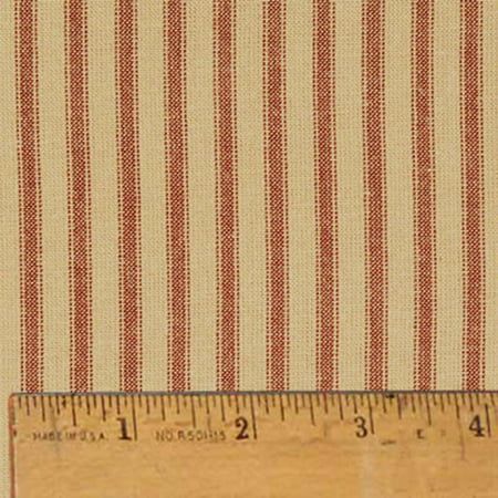 a ruler is next to a red and white striped fabric