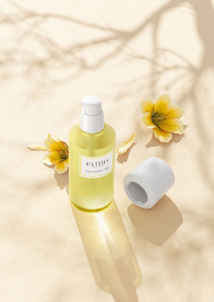 a bottle of lotion sitting on top of a table next to a vase with flowers