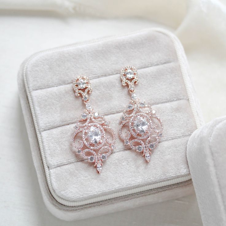 Fit for a princess on her wedding day, our KENDRA rose gold cz bridal earrings dangle effortlessly and the cubic zirconia stones sparkle like real diamonds. Length: 2.125 Inches; Width: 1 Inches Available in rose gold, yellow gold or rhodium (silver) Rose Gold Bridal Earrings, Rose Gold Earrings, A Princess, Earrings Dangle, Real Diamonds, Bridal Earrings, Gold Yellow, Cubic Zirconia, Dangle Earrings