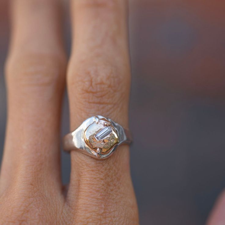 Recycled gold nugget, prong set on a sterling silver signet, featuring a baguette white diamond one-of-a-kind Signet ring size 7 5mm x 2mm, white baguette diamond signet face is repurposed 10K & 14K gold. band is 4mm wide All Oxbow jewelry is made in and ships from my Denver studio. Organic Jewellery, Organic Jewelry, Silver Signet Ring, Gold Nugget, Recycled Gold, Baguette Diamond, Gold Band, Three Stone, Signet Ring