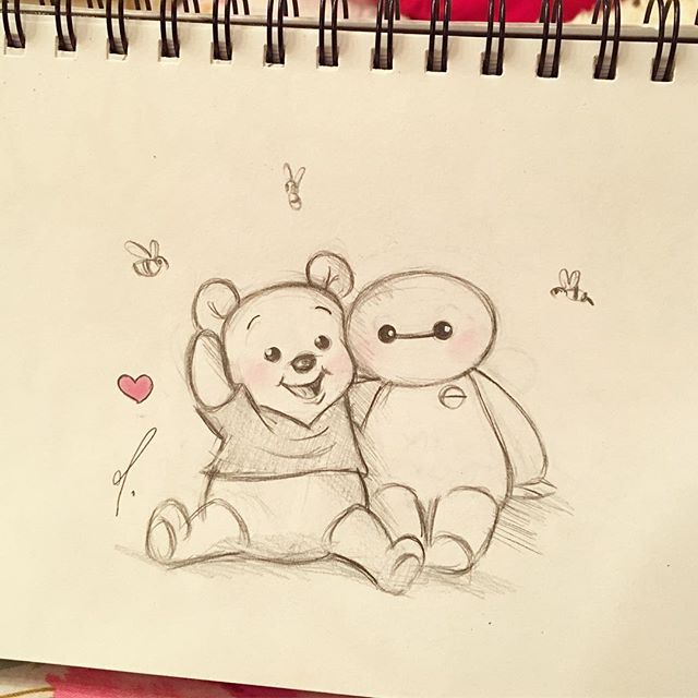 a drawing of two teddy bears sitting next to each other on a piece of paper