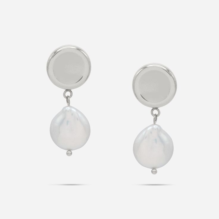 Experience a touch of elegance with our Ness Keshi Pearl Drop Earrings. Made with jewelry-grade stainless steel, these round mirrored stud earrings feature a dangling Keshi freshwater pearl. Elevate your style with these timeless and versatile earrings. Details: - Gold: 316L Stainless Steel, 18K Gold PVD Plated, Keshi Freshwater Pearls- Silver: 316L Stainless Steel, Keshi Freshwater Pearls Classic Metal Earrings With Pearl Charm, Modern White Earrings With Pearl Charm, Classic Metal Pearl Earrings With Pearl Charm, Modern Pearl White Earrings With Pearl Drop, Modern Pearl White Earrings With Pearl Charm, Modern Metal Pearl Drop Earrings, Modern Metal Drop Pearl Earrings, Modern Dangle Earrings With Pearl Drop, Classic Metal Jewelry With Pearl Drop