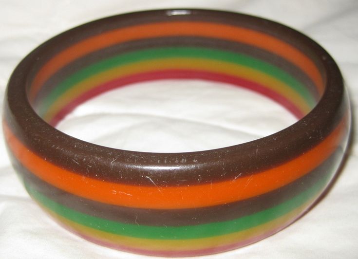 From my private collection. See pics for size. Vintage bracelet. Circa 1950-60s. Bakelite. I've owned it nearly 30 yrs. Very good vintage condition. Surface wear. Lovely authentic vintage piece. Very collectible. Priced has been reduced to wholesale cost. Handmade Retro Bangle Bracelet, Vintage Red Round Bangle, Vintage Handmade Red Bangle, Green Vintage Cuff Bracelet, Vintage Multicolor Bracelets, Handmade Retro Bangle For Gifts, Vintage Collectible Cuff Bangle Bracelet, Vintage Collectible Bangle Cuff Bracelet, Retro Multicolor Bangle Jewelry