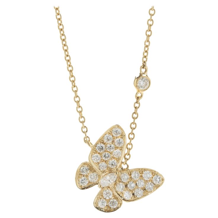 Designer: custom design Material: 18K yellow gold Diamonds: 27 round brilliant cut = .55cttw Color: G Clarity: SI1 Diamonds: 1 marquise cut = .07ct Color: G Clarity: SI1 Dimensions: necklace measures 18-inches in length Weight: 4.71 grams Diamond Butterfly Necklace, Diamond Butterfly, Butterfly Jewelry, Butterfly Necklace, Marquise Cut, Pave Diamonds, Round Brilliant, Gold Diamond, Jewelry Necklace Pendant