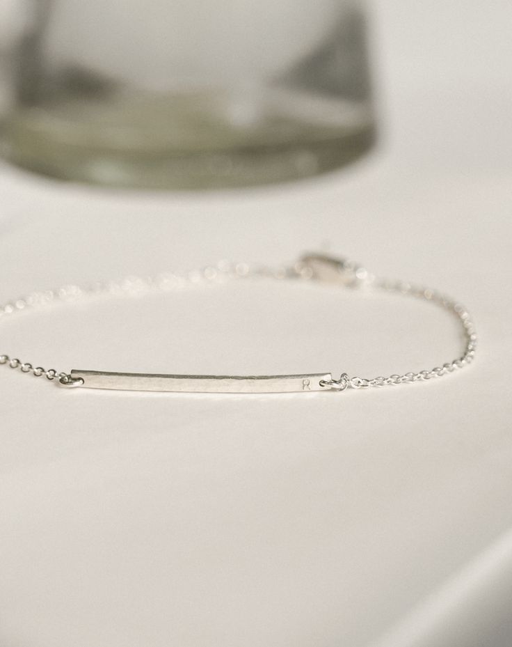 This barely-there bar bracelet is tiny, shiny and extra personal—no, really, these letters are teeny! Personalize with names, initials or dates (short inscriptions look best) and add a subtle story to your stack. PERSONALIZATION NOTES This bar bracelet is too small to include longer inscriptions, accent marks or degree symbols. Shop our medium-sized Getty Bar Bracelet or bold Serra Bar Bracelet for a bigger statement with more personalization options. Coordinates Bracelet, Bar Bracelet, Bar Bracelets, Gold Material, Real Gold, Gold Vermeil, Solid Gold, Gold Filled, Dates