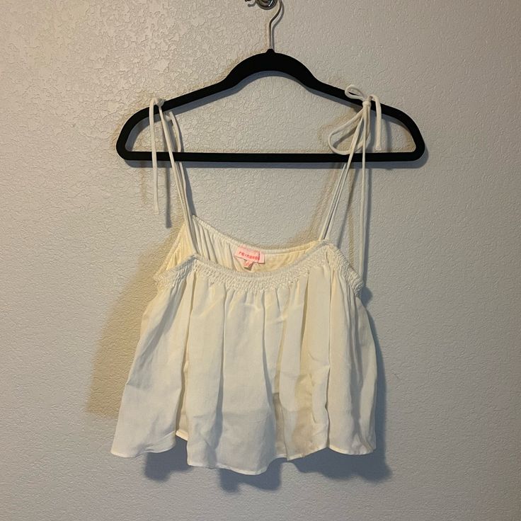 Flowy Crop Top With Built-In Shelf Bra. Straps Are Fully Adjustable. Never Worn. Pet And Smoke Free Home White Camisole Crop Top For Beach, Feminine White Camisole Crop Top, Casual Ruffled Camisole Crop Top, White Feminine Crop Top For Vacation, White Feminine Crop Top With Spaghetti Straps, White Camisole Crop Top For Day Out, White Camisole Crop Top For Spring, White Summer Crop Top With Spaghetti Straps, White Spaghetti Strap Crop Top For Summer