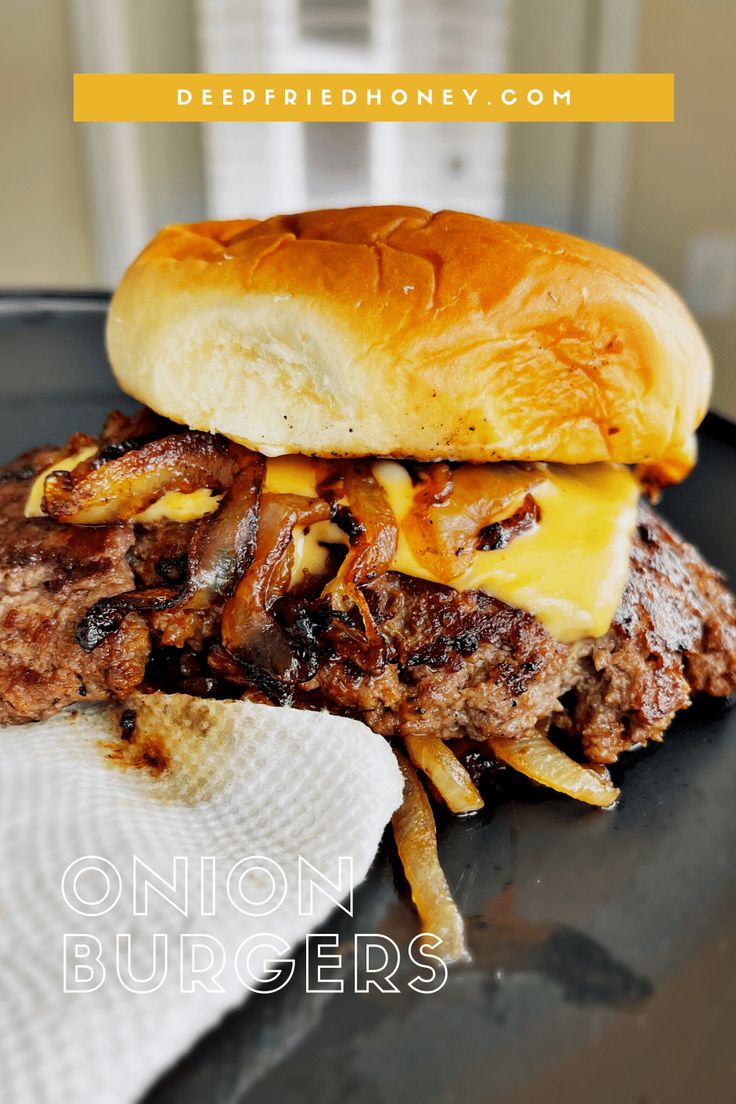 a close up of a sandwich on a plate with french fries in front of it