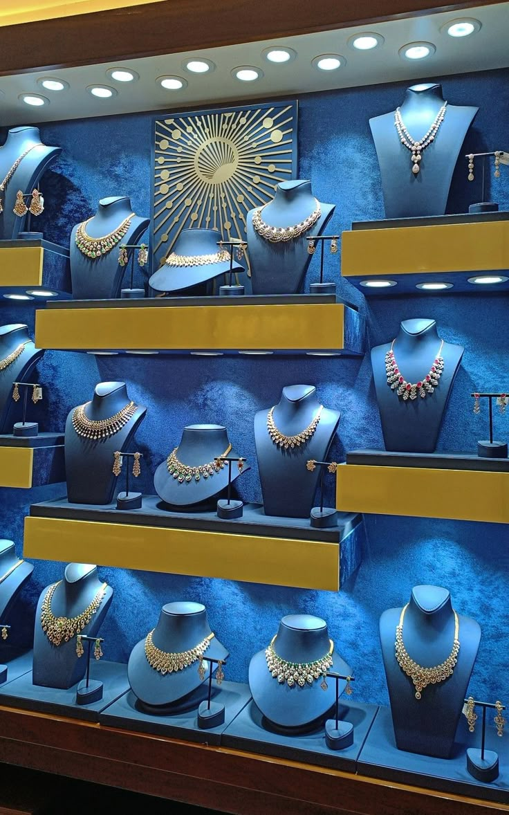 a display case filled with blue and gold jewelry