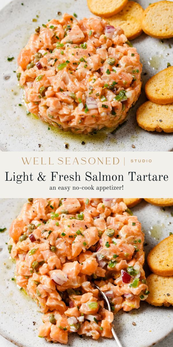 salmon salad on a white plate with crackers