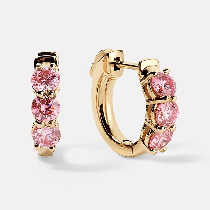 Oh la la!  Wowsers, sooo beautiful!  You cannot NOT look at these stunning earring s.  Three good sized brilliant pink diamonds set in precious gold huggy style earrings. These will be your new favorites. Each diamond is about 3.5mm diameter, set closely to each other.  The total weight is a full 1ctw of lab-grown pink diamonds.  We use VS clarity, so they sparkle like crazy. The mountings are a solid well made piece with a nice secure latch.  You'll love them.   Give her a gift she will cherish Luxury Pink Brilliant Cut Diamond Earrings, Luxury Pink Diamond Earrings Brilliant Cut, Luxury Pink Earrings With Brilliant Cut, Pink Brilliant Cut Diamond Earrings, Pink Brilliant Cut Earrings In Fine Jewelry Style, Luxury Pink Hoop Earrings, Formal Pink Diamond Earrings With Prong Setting, Pink Cubic Zirconia Hoop Earrings, Pink Huggie Earrings For Anniversary