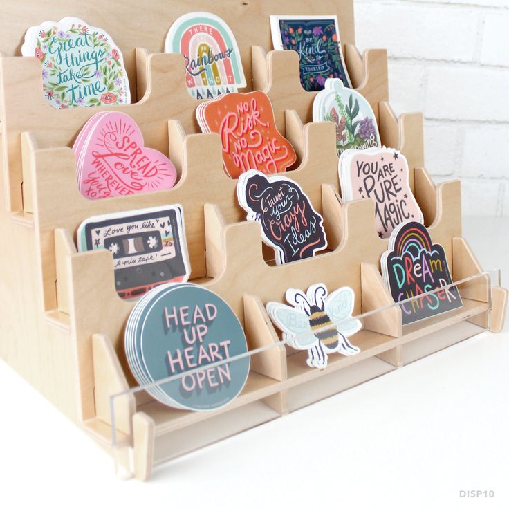 an assortment of magnets in a wooden holder