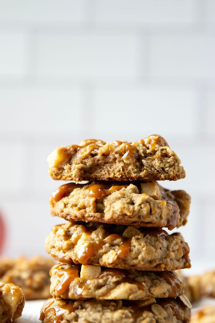 a stack of oatmeal cookies with caramel drizzle on top