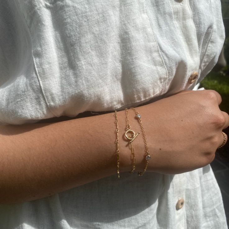 Our three best selling bracelets that make an amazing stack is finally get sold in a stack! This stack includes: Leora bracelet, Toggle bracelet and the Sylvia bracelet. Gold Filled Available in sizes 5.5", 6", 6.5", 7", 7.5" and 8" Everyday Stackable Round Bracelets, Dainty Resizable Chain Bracelet For Everyday, Dainty Everyday Stacked Jewelry, Dainty Resizable Chain Bracelet, Everyday Stackable Round Gold Bracelet, Everyday Dainty Stackable Chain Bracelet, Everyday Stackable Gold Bracelet, Adjustable Stacked Jewelry, Dainty Hypoallergenic Bracelets For Layering