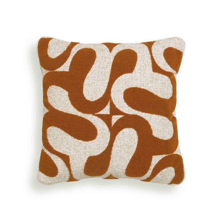 an orange and white pillow on a white background