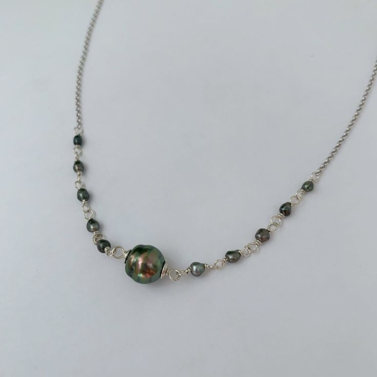 "Looking for something unique and different? This beautiful necklace displays a nice and small Tahitian Pearl paired with small and dainty tahitian keshis pearls . ✨This Listing is for Sterling Silver. For the Gold-filled necklace is click on the following link: Length : 17-18\" if you need a different size please specify at checkout . There is an extender on the back to make it more versatile and can be adjusted slightly about 1\" . Description ✨Tahitian pearls: Size : 8-9mm small and dainty si Tahitian Pearl Jewelry With High Luster Beads, High Luster Tahitian Pearl Round Beads Jewelry, High Luster Tahitian Pearl Necklace, Silver Baroque Pearl Necklaces With Round Beads, Unique Pearl Necklace Chain As Gift, Unique Pearl Chain Necklace For Gift, Handmade Tahitian Pearl Necklace Gift, Silver Single Strand Pearl Pendant Necklace, Handmade Pearl Necklace With Briolette Shape