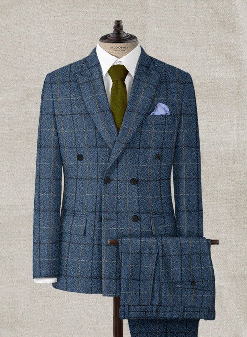 Channel boss vibes everyday with this refined Harris Tweed Gordon Blue Double Breasted Suit to look great in this new season. Crafted from wool, the suit is a stylish piece for your next elegant affair with a shade of blue that will help you charm your way through tedious tasks and an impeccable checks design that carries a timeless appeal. The suit will seamlessly blend together with your favorite shirt to create an eye catching ensemble. 
 
 Look Includes  Harris Tweed Gordon Blue Fabric  Doub Tailored Tweed Suits For Business Casual, Blue Tweed Suit For Work, Blue Tweed Suits For Work, Luxury Tweed Suits For Semi-formal Occasions, Luxury Semi-formal Tweed Suit, Tweed Notch Lapel Suit For Business Casual, Tweed Three-piece Suit With Notch Lapel For Work, Business Casual Tweed Suits With Notch Lapel, Fall Blue Double Breasted Suit For Work