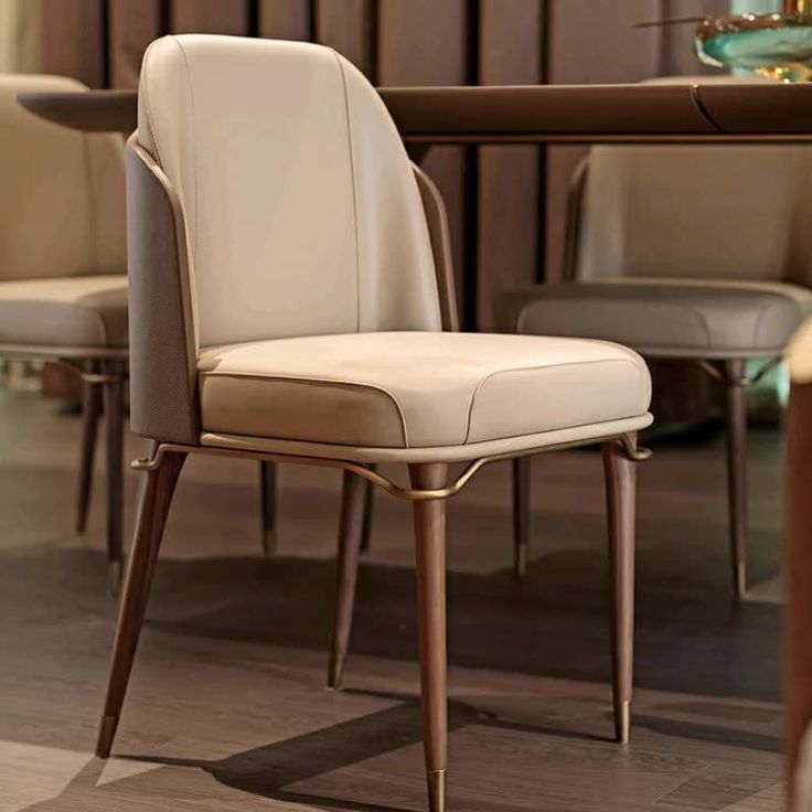 a white chair sitting in front of a wooden table