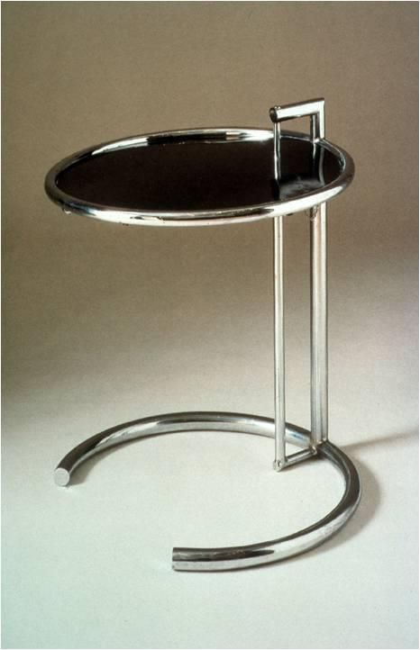 a round table with a metal frame and black glass top, on a white background