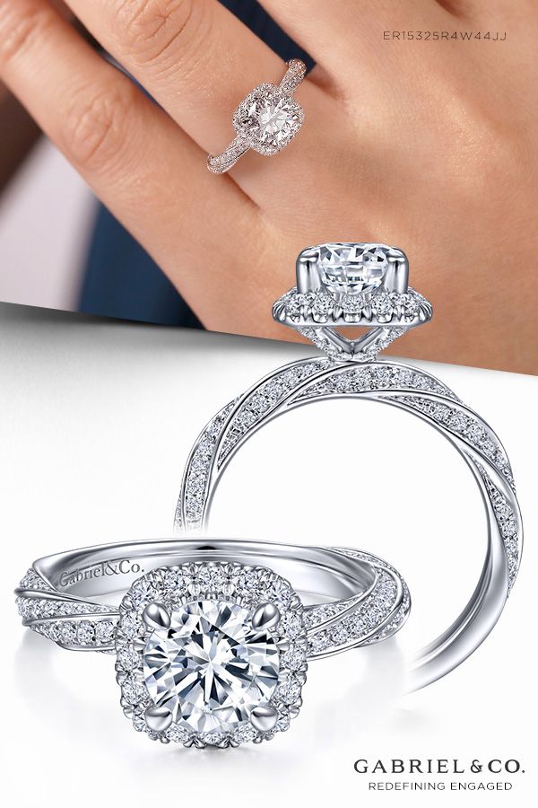 a woman's hand with two engagement rings on it