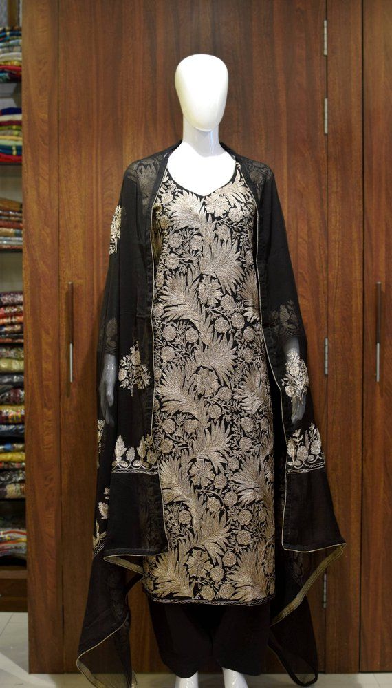 A stunningly marvellous outfit. This outfit features intricate Kashmir aari embroidery with silk thread on all over the shirt front, on sleeves and 2 sided embroidery border on the dupatta with all over booties of same work.- - - - - - - - - - - - - - - - - - - - Product DetailsCondition: Brand NewF A B R I CShirt: Viscose GeorgetteDupatta: ChiffonLower: Indian CrepeF I N I S HUnstitched/Semi-StitchedYou can get it stitched locally.47+ inches of Shirt Length and upto full sleeves length.Stitched Woolen Suits Women Indian, Kashmiri Suits, Kashmir Embroidery, Tilla Embroidery, Patiyala Dress, Kashmiri Embroidery, Bridal Suits, Embroidery Border, Embroidered Suit