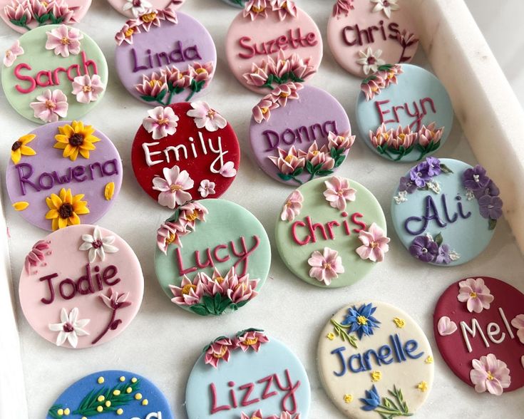 a tray filled with lots of different colored buttons