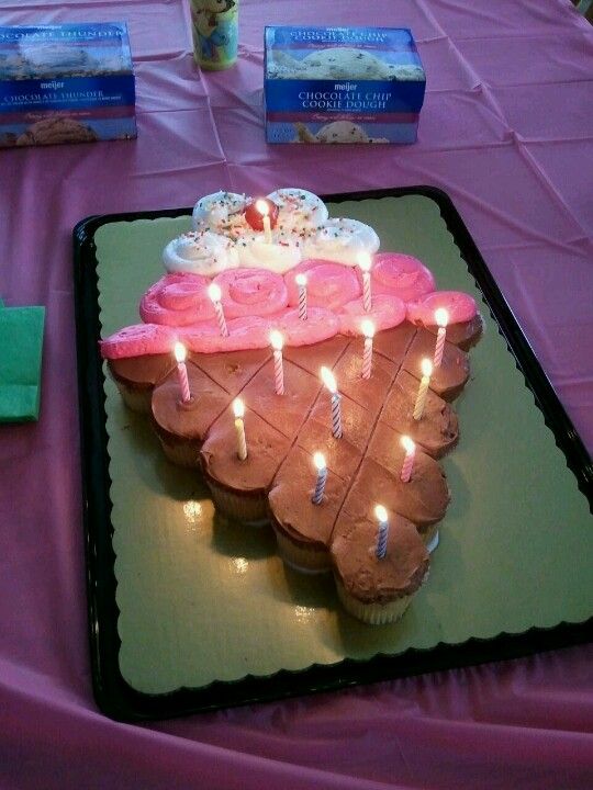 a birthday cake with lit candles on it