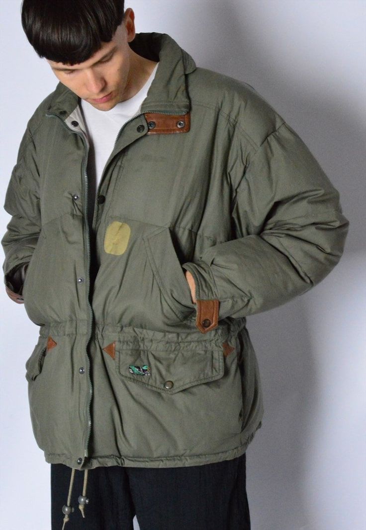 Vintage 80s Khaki Green Padded Puffer Winter Mens Jacket P.S few small wear marks Marked size: M Estimated Size: M Chest: 50.1 In (127 cm) Jacket length: 29.2 In (74 cm) Sleeve length: 22.1 In (56 cm) Shoulder to shoulder: 24.9 In (63 cm) Material: Shell: 100% cotton, filling: down The model is 183cm (6ft) tall and usually wears size S/M clothes Be sure to contact us with any questions :) Follow us on Facebook (fb.com/magicxkale) or IG-magicxkale Casual Parka With Padded Collar For Outdoor Activities, Khaki Puffer Jacket With Pockets For Streetwear, Retro Outerwear For Fall Outdoor Activities, Vintage Khaki Outerwear For Cold Weather, Vintage Streetwear Outerwear With Padded Collar, Vintage Outerwear With Padded Collar For Streetwear, Retro Winter Outerwear With Padded Collar, Vintage Outerwear With Padded Collar For Cold Weather, Vintage Khaki Winter Outerwear