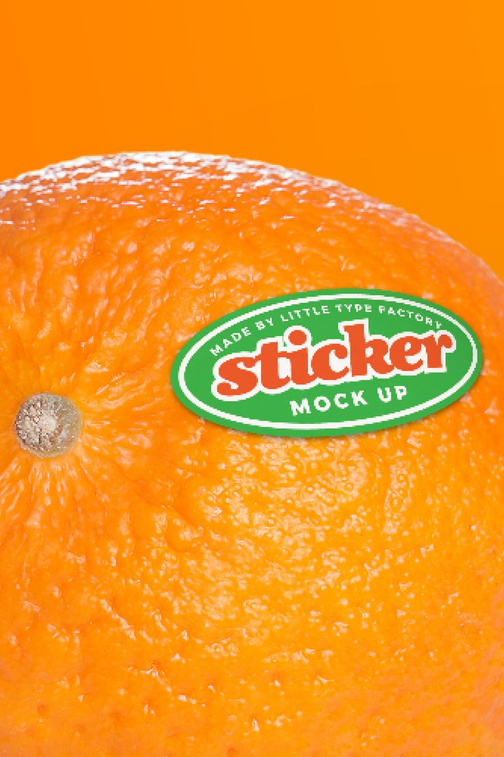 an orange with the sticker mock up on it's side is shown in front of an orange background