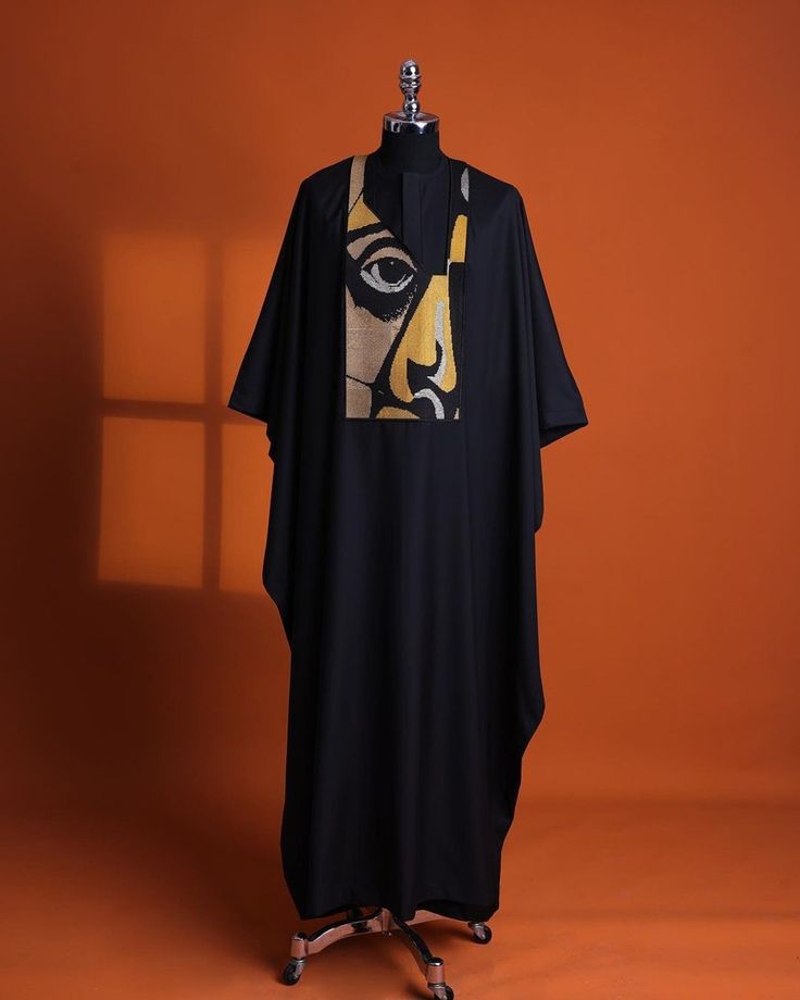 A charcoal black, “oju aye” on canvas gold and black mix embroidery details agbada, silver clear view swarovski buttons on 3/4 sleeve kaftan & sokoto  what you get:  agbada kaftan men’s top pant trousers  price - available on website  to order:  email: info@dejiandkola.com website: dejiandkola.com African Apparel, Imessage Text, Costume Africain, Latest African Men Fashion, Unique Outfit, African Men Fashion, African Men, Charcoal Black, Clear View