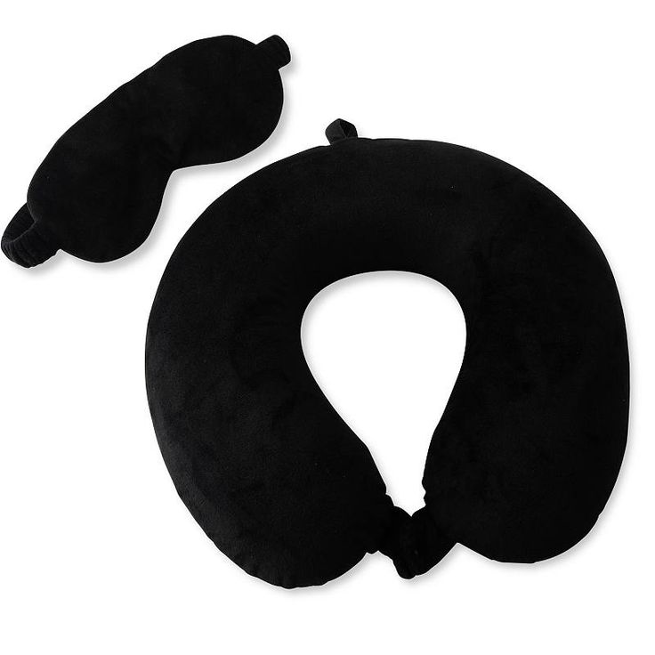 two black neck pillows sitting next to each other