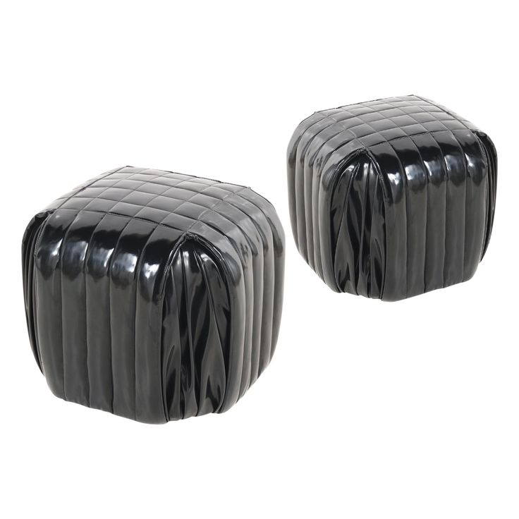 two black leather stools sitting next to each other